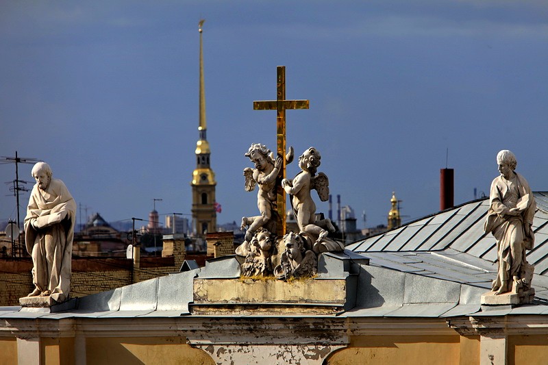 Angels and a cross at the top of St Catherine's Church on Nevsky Prospekt in St Petersburg, Russia Angels and a cross at the top of St Catherine's Church on Nevsky Prospekt in St Petersburg, Russia